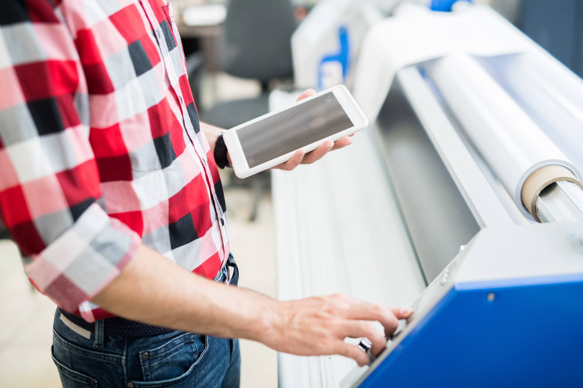 crop-man-with-tablet-using-printing-equipment-PUNL92Q-min